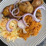 Plate of Jollof Rice with chicken and onions